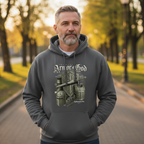 Man wearing a gray hoodie with Armor of God graphic design in a park