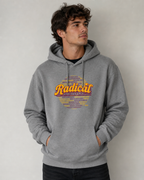 Man wearing a gray hoodie with colorful text design on a plain background